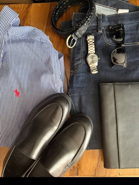 Gingham shirt, dark loafers, jeans, a braided belt, and a steel watch