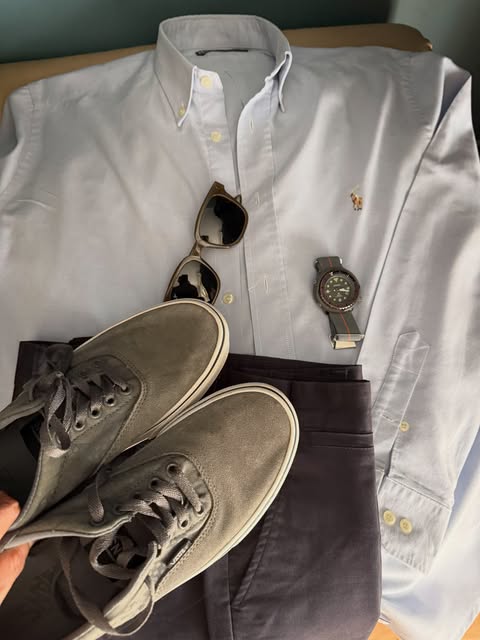 Light blue oxford, grey suede sneakers, navy trousers, and a field watch