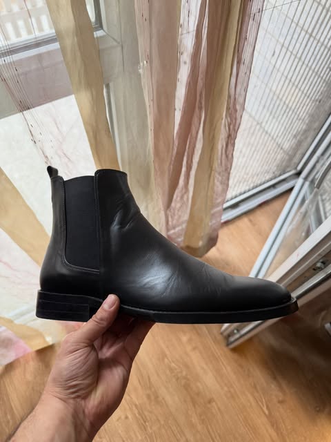 Black leather Chelsea boot in profile