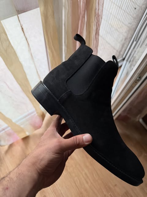 Black suede Chelsea boot in profile