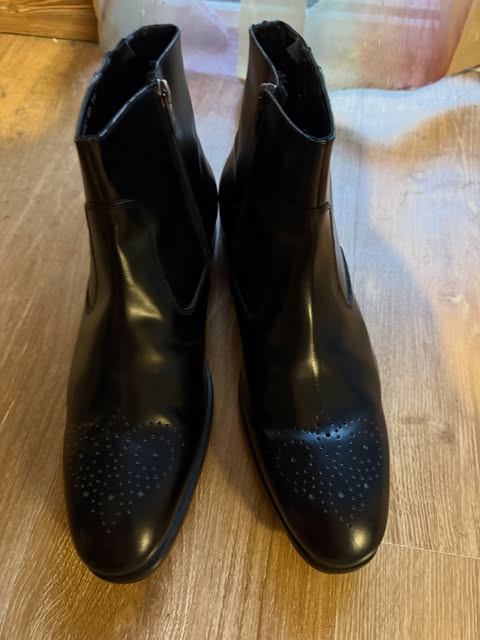 Black leather brogue boots with a side zip